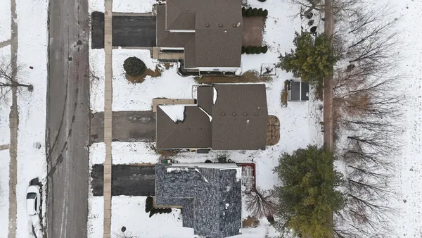 an aerial view of house with yard