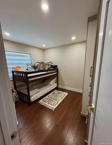 a living room with a piano and a table