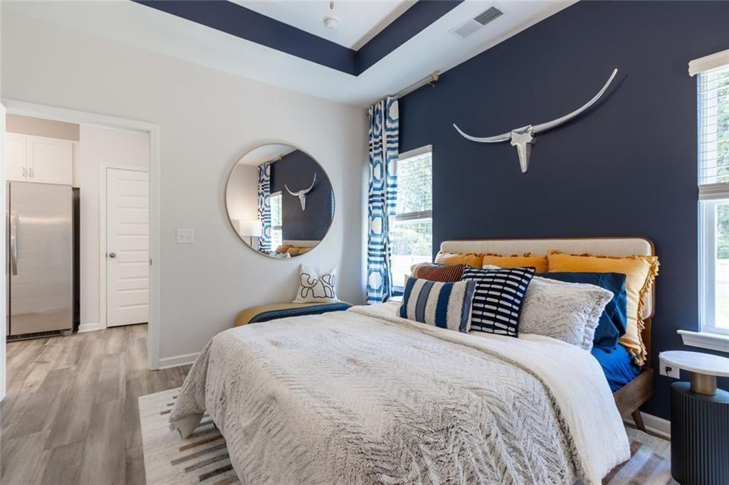 141 Andros Loop Dalton, GA 30721 - Photo 12 of 25 a bedroom with a bed and a mirror