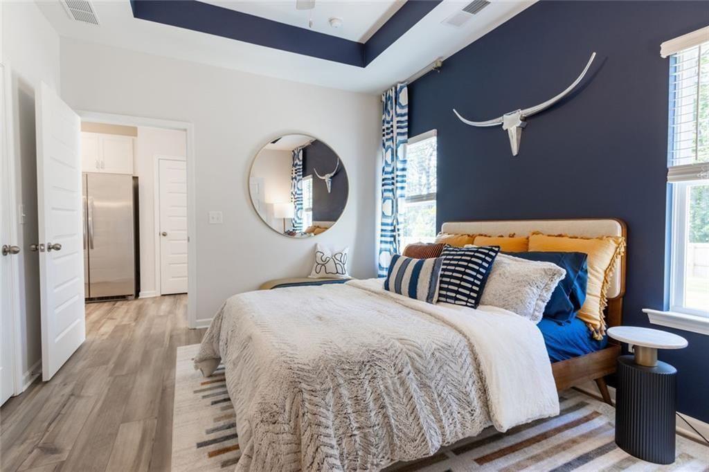 141 Andros Loop Dalton, GA 30721 - Photo 14 of 25 a bedroom with bed and a mirror