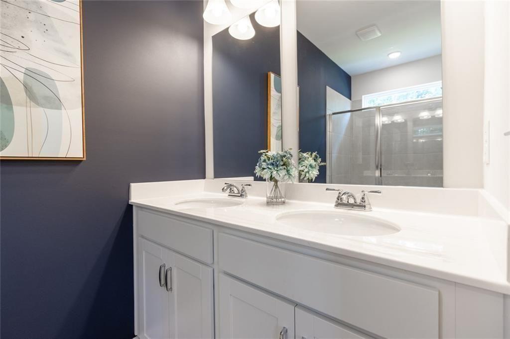 141 Andros Loop Dalton, GA 30721 - Photo 17 of 25 a bathroom with a sink and a mirror