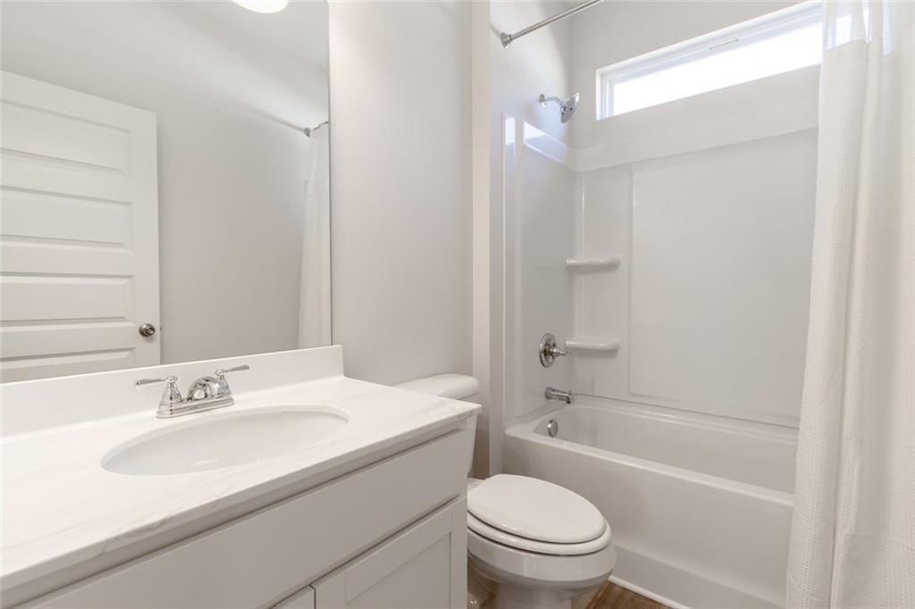 141 Andros Loop Dalton, GA 30721 - Photo 23 of 25 a bathroom with a sink toilet and shower