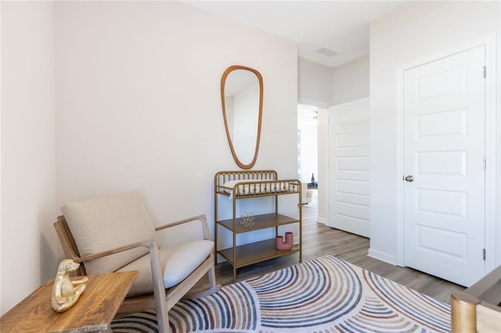141 Andros Loop Dalton, GA 30721 - Photo 24 of 25 a bedroom with a bed and a rug