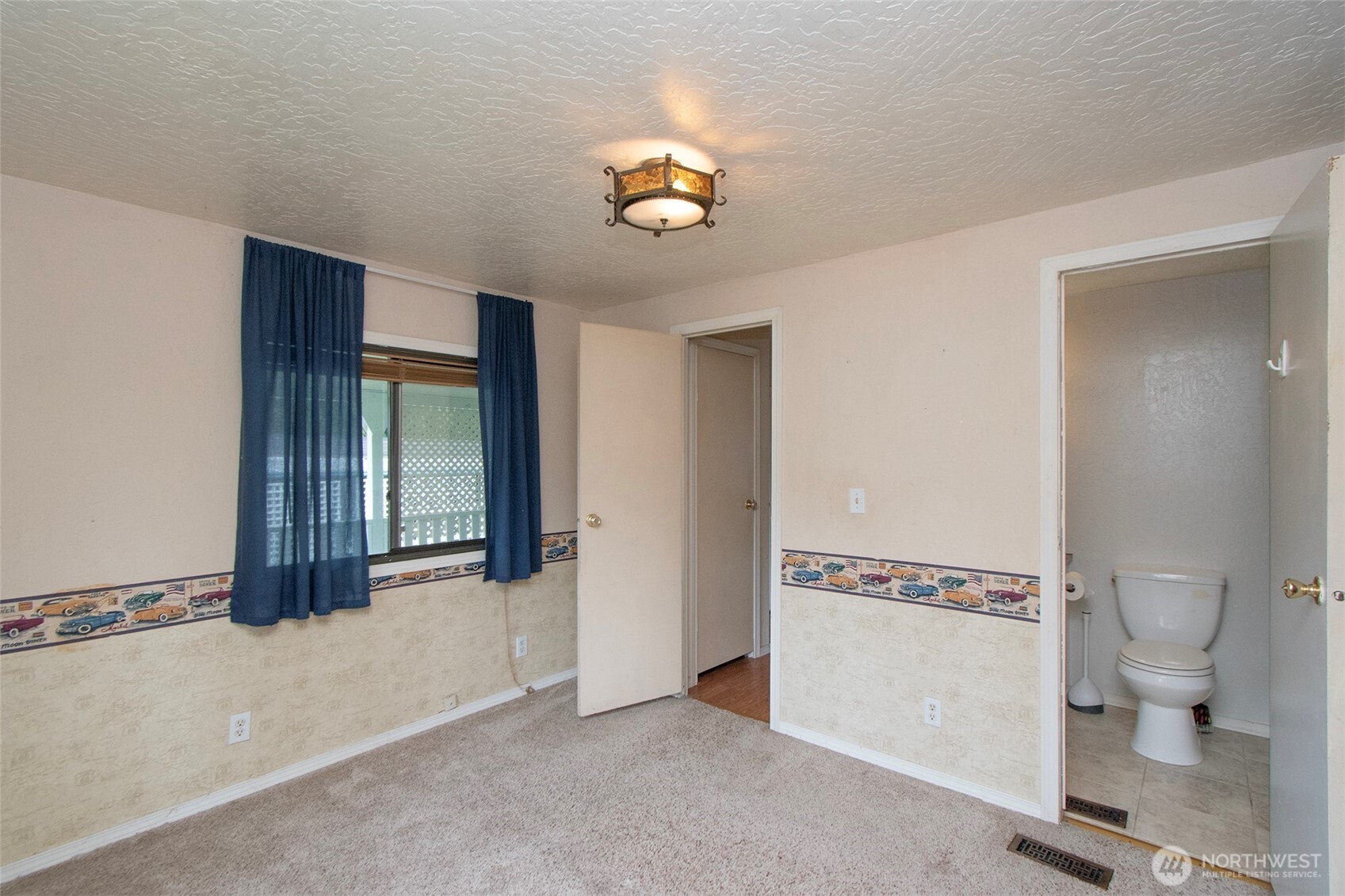 90 Baywood Village Road, Unit 34 Sequim, WA 98382 - Photo 21 of 40 a view of a hallway with a chandelier