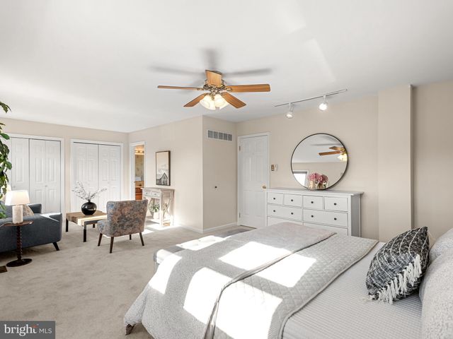 a bedroom with a bed and furniture