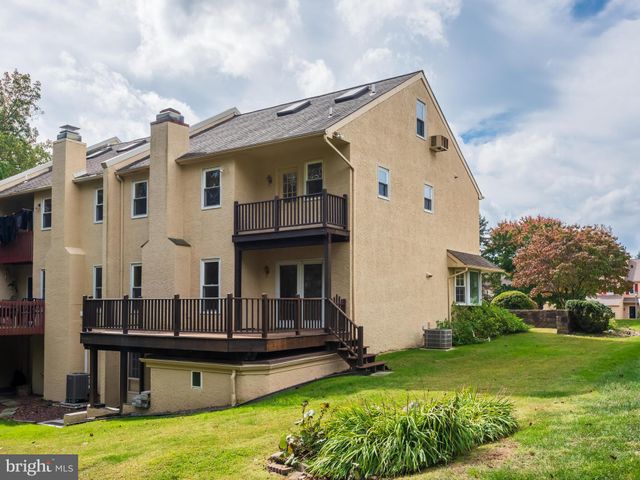 a view of house and yard with swimming pool and sitting area