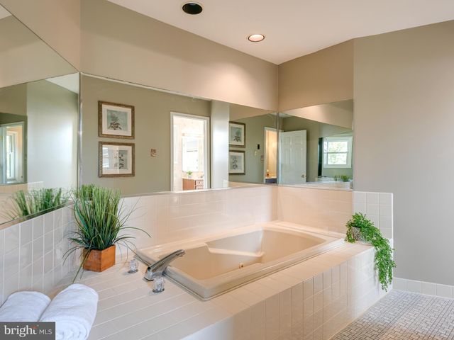 a living room with furniture and flowers