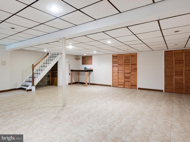 a view of empty room with white walls