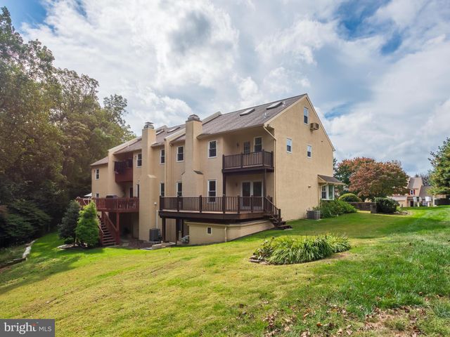 a view of house with yard and green space
