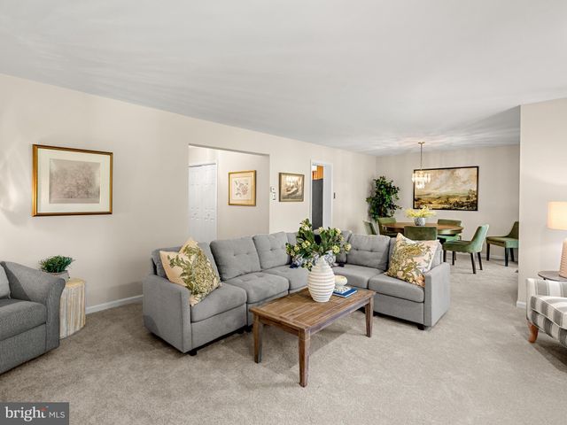 a living room with furniture and windows