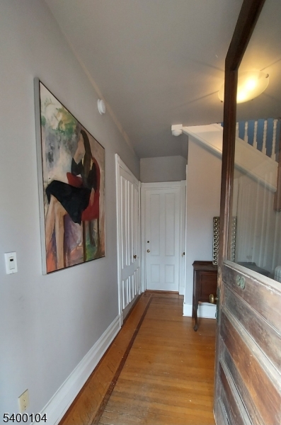 80 Grove Street Montclair, NJ 07042 - Photo 2 of 15 a bedroom with a bed and a painting on the wall