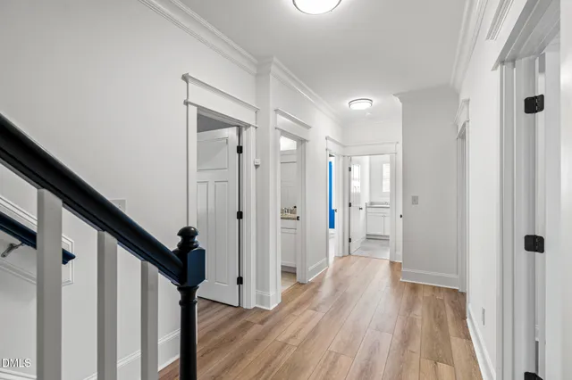 a bathroom with a double vanity sink mirror and bathtub