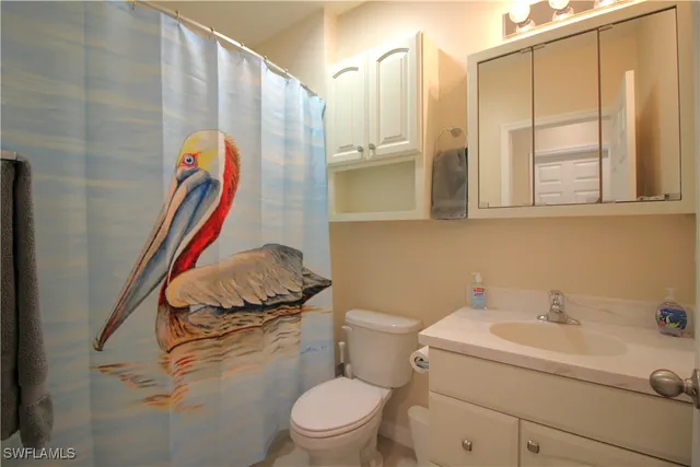 a living room with furniture and a lamp