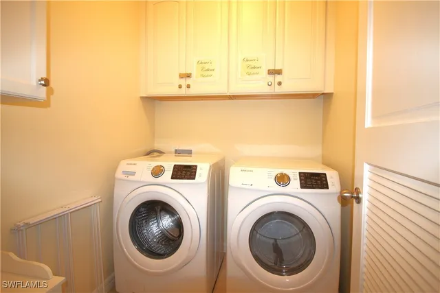 a view of a lake with a garden and houses