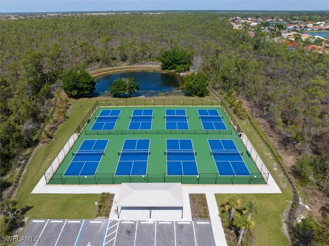 an aerial view of a house with swimming pool garden and patio