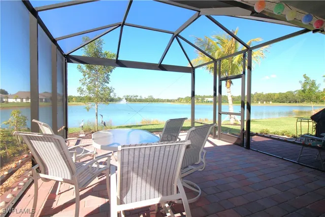a view of swimming pool with outdoor seating and city view