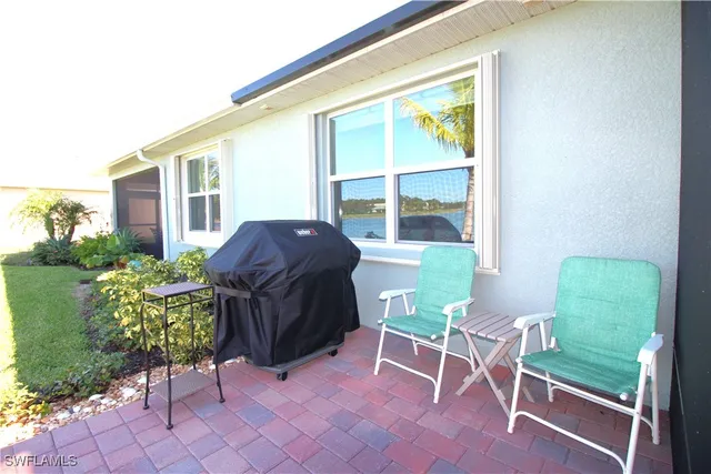 a large bed sitting in a bedroom next to a window
