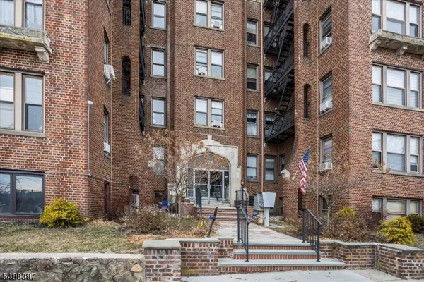 a front view of a multi story residential apartment building