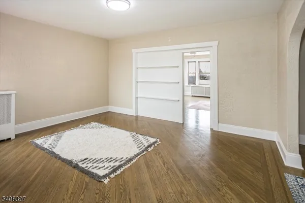 an empty room with wooden floor