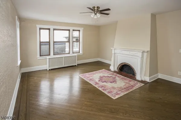 a living room with couch and a fireplace