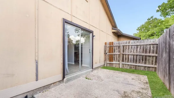 a porch with a small yard