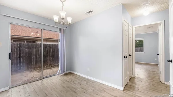 a view of a chandelier in a room with a chandelier