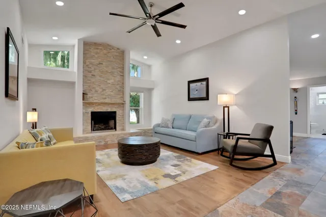 a bedroom with a bed and glass walk in closet