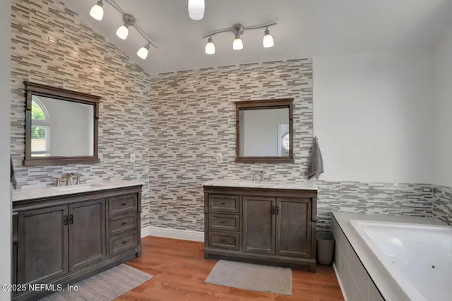 a bedroom with a bed and a television