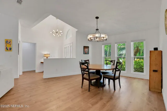 a view of indoor pool with sitting area