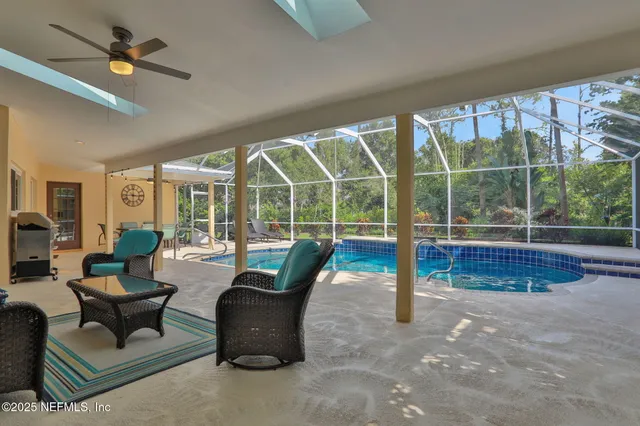 a view of a grassy field with trees