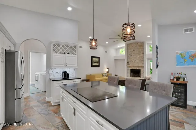 a kitchen with a sink and large window