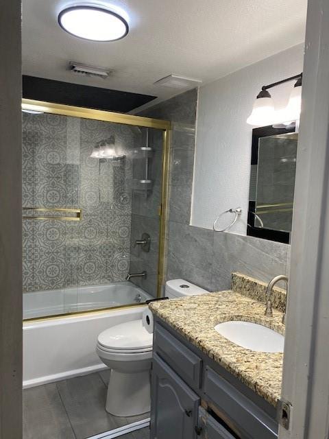 2315 Jimmydee Drive Irving, TX 75060 - Photo 12 of 14 a bathroom with a granite countertop sink toilet mirror and bathtub