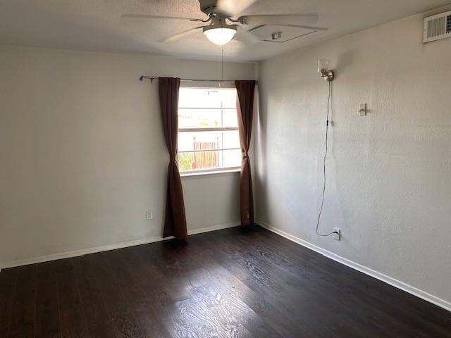 2315 Jimmydee Drive Irving, TX 75060 - Photo 13 of 14 an empty room with wooden floor and windows