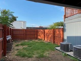 2315 Jimmydee Drive Irving, TX 75060 - Photo 2 of 14 a view of a backyard with plants and wooden fence