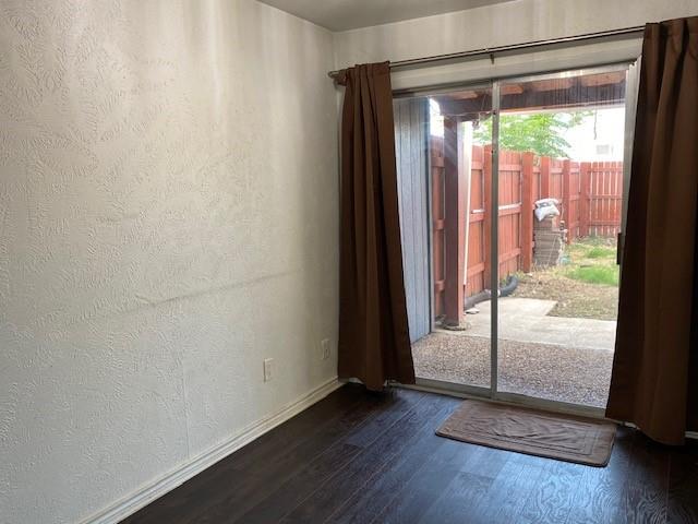 2315 Jimmydee Drive Irving, TX 75060 - Photo 6 of 14 an empty room with wooden floor and windows