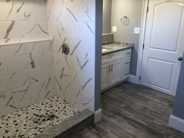 a bathroom with a sink and a mirror