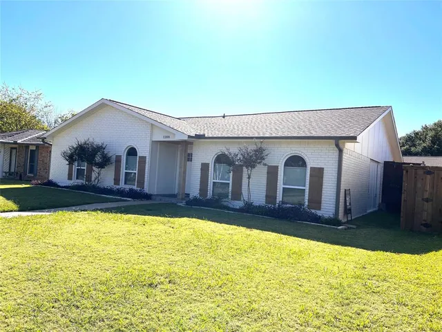 a view of swimming pool with house in the background