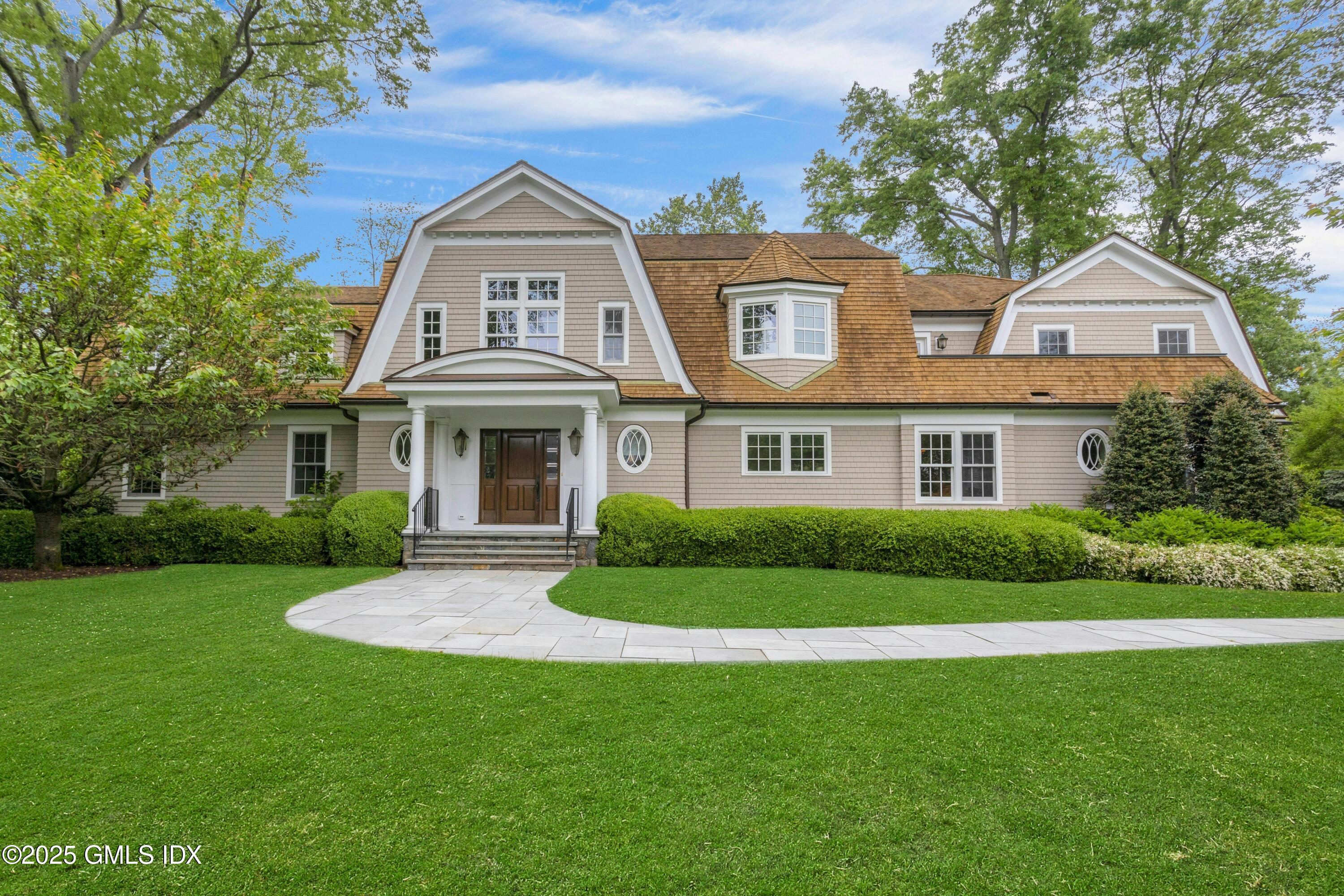 a front view of a house with a yard