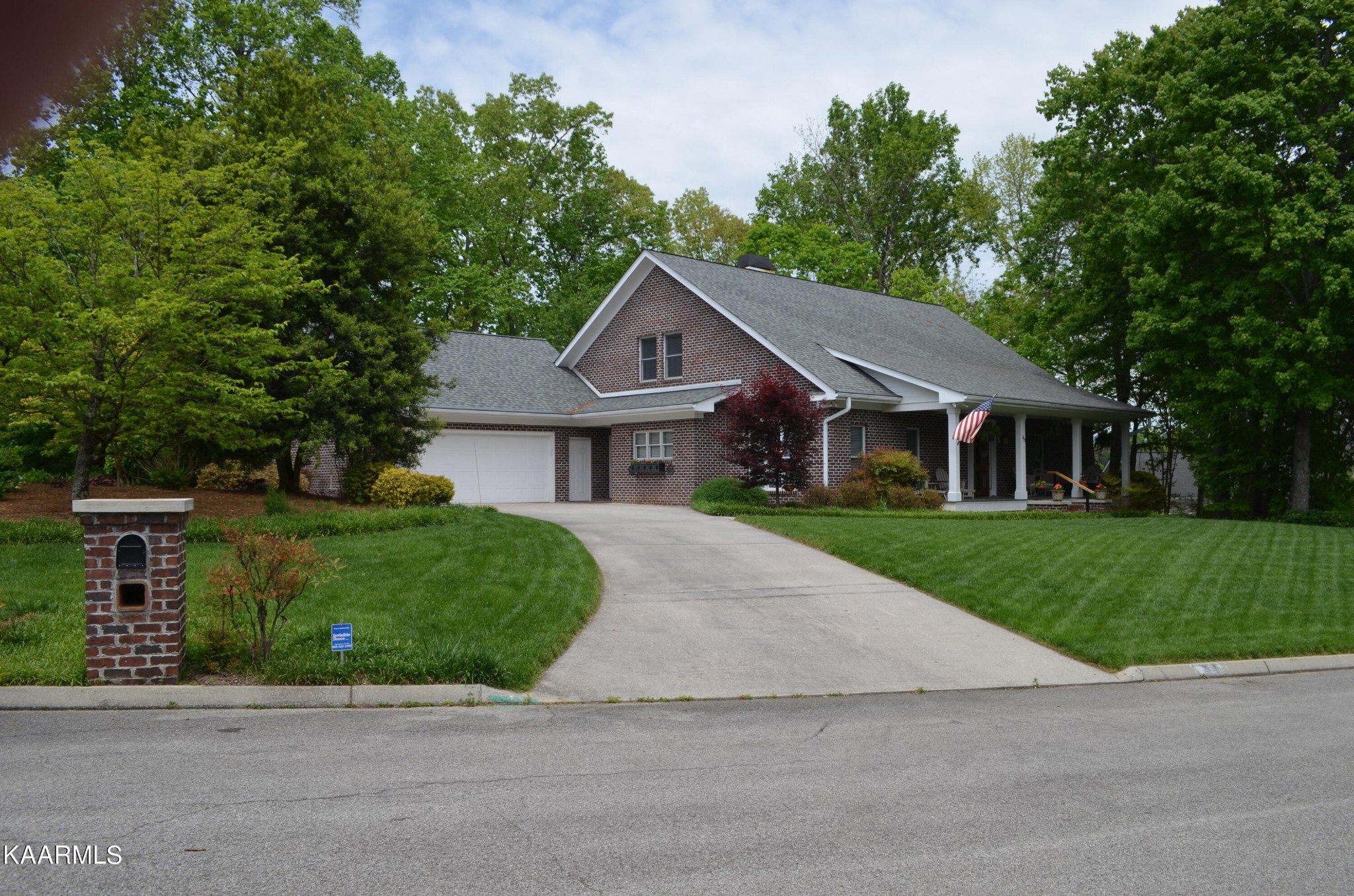 111 Dover Lane Oak Ridge, TN 37830 - Photo 1 of 60 a front view of a house with a garden and trees