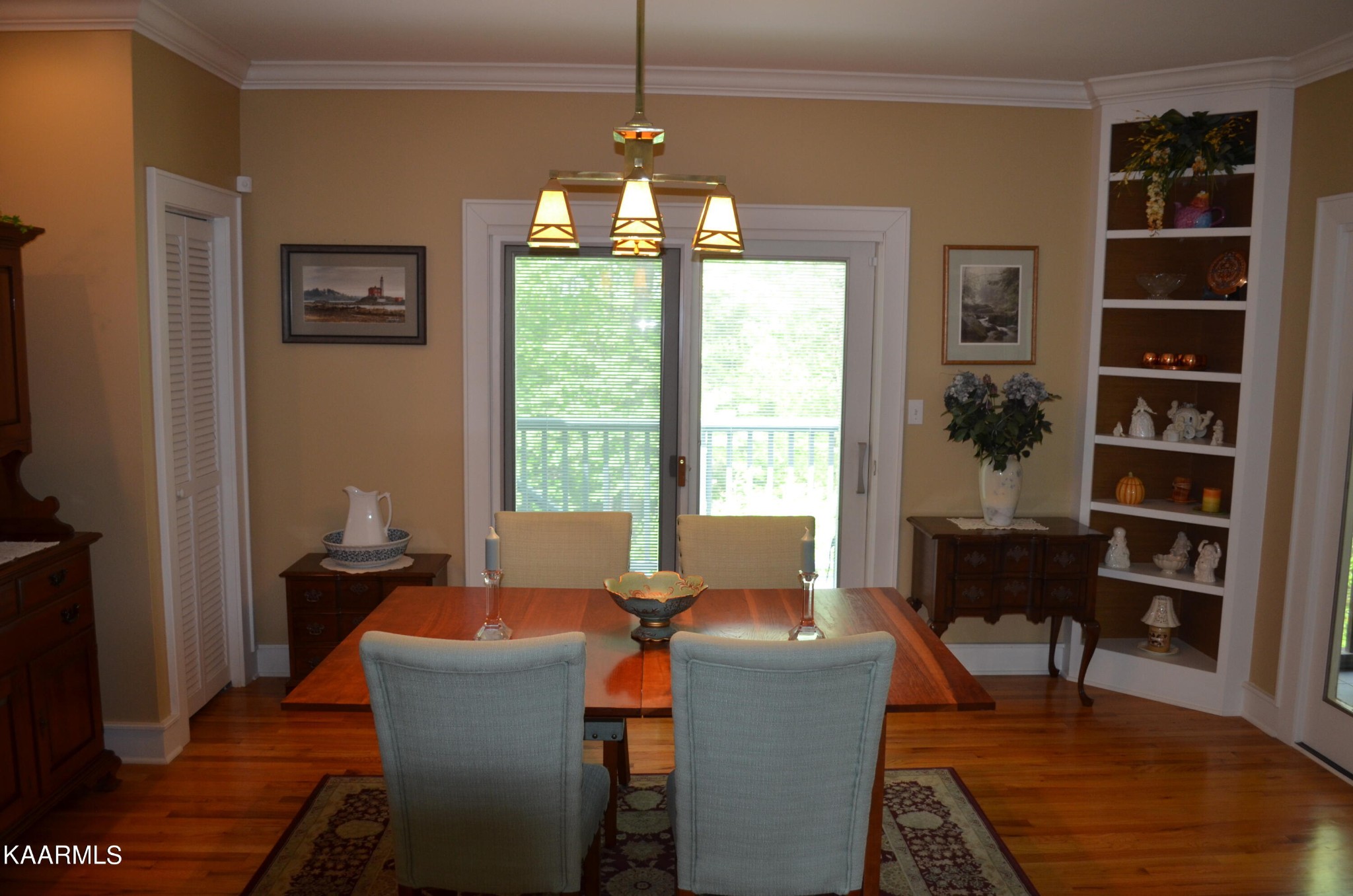 111 Dover Lane Oak Ridge, TN 37830 - Photo 18 of 60 a dining room with furniture a window and wooden floor