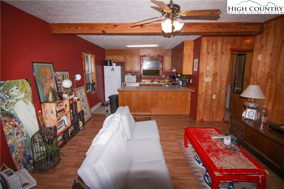 367 Sugarloaf Road Boone, NC 28607 - Photo 5 of 15 a living room with furniture and a chandelier