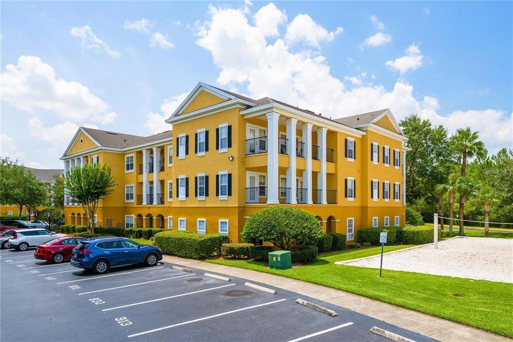 3599 Conroy Road, Unit 933 Orlando, FL 32839 - Photo 1 of 1 a front view of a house with a garden
