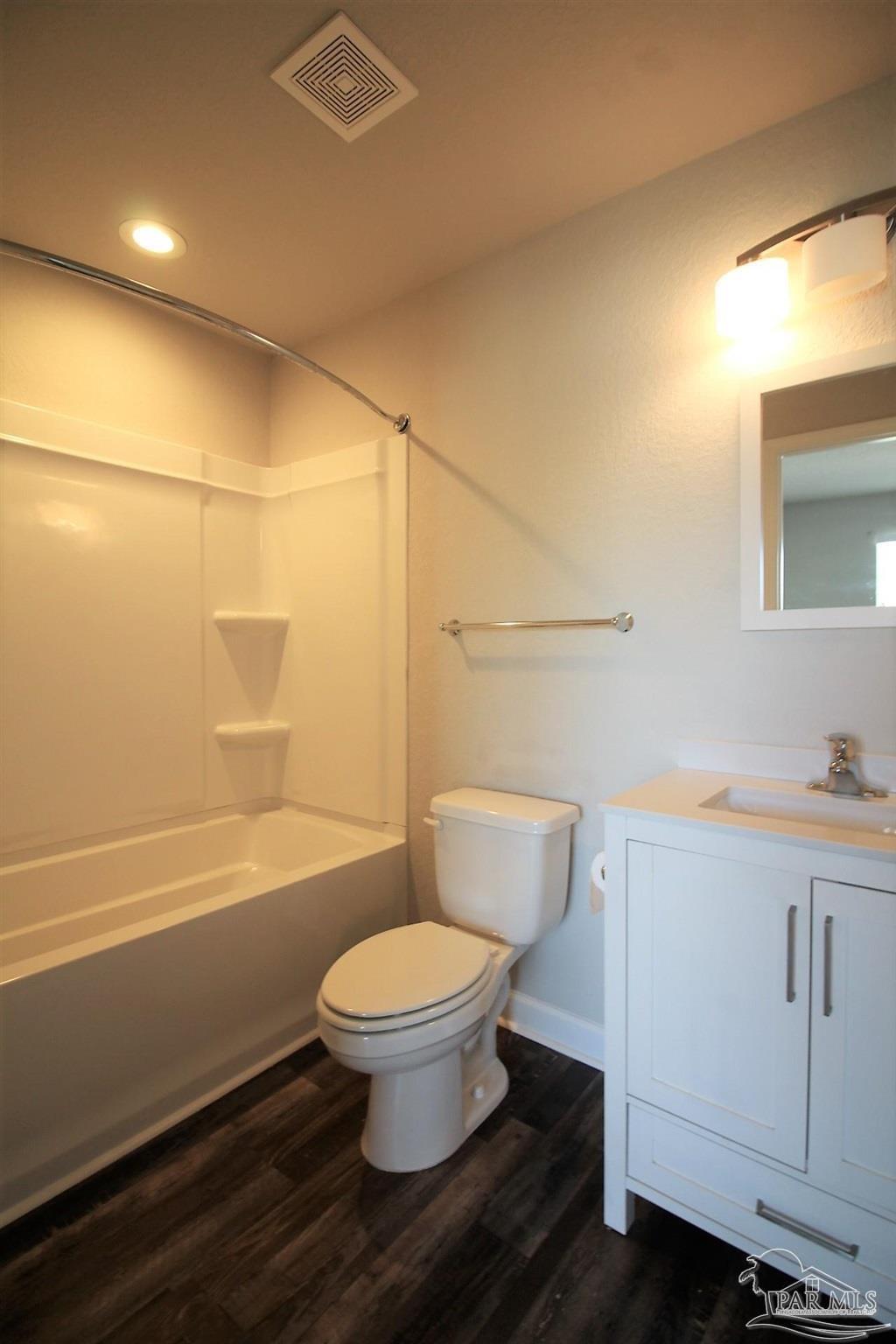 150 South Crow Road, Unit 602 Pensacola, FL 32506 - Photo 8 of 12 a bathroom with a toilet a sink and bathtub
