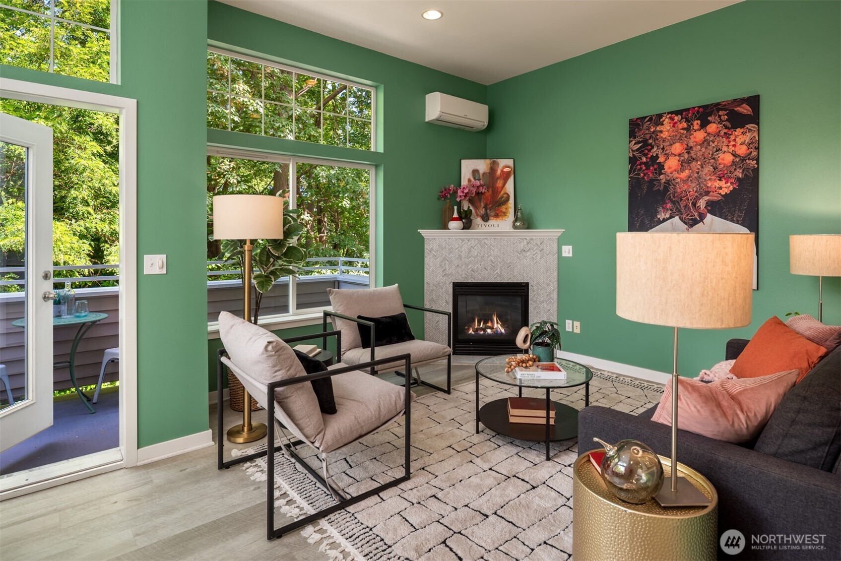 3302 West Government Way, Unit A Seattle, WA 98199 - Photo 5 of 32 a living room with furniture and a fireplace
