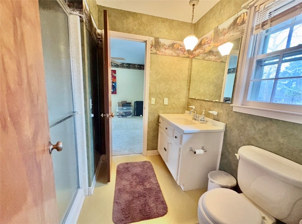 402 Loblolly Drive Anderson, SC 29625 - Photo 21 of 43 This bathroom features a functional vanity, an accessible window, and a spacious shower.