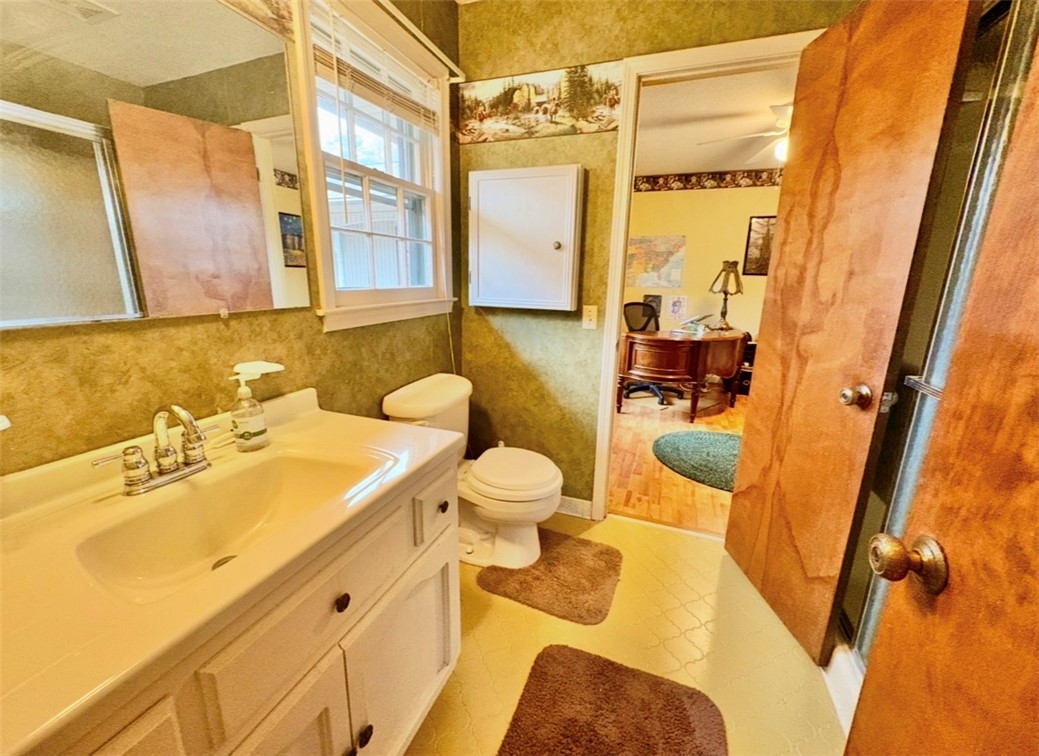 402 Loblolly Drive Anderson, SC 29625 - Photo 22 of 43 This bright bathroom features a spacious vanity with a window offering natural light.