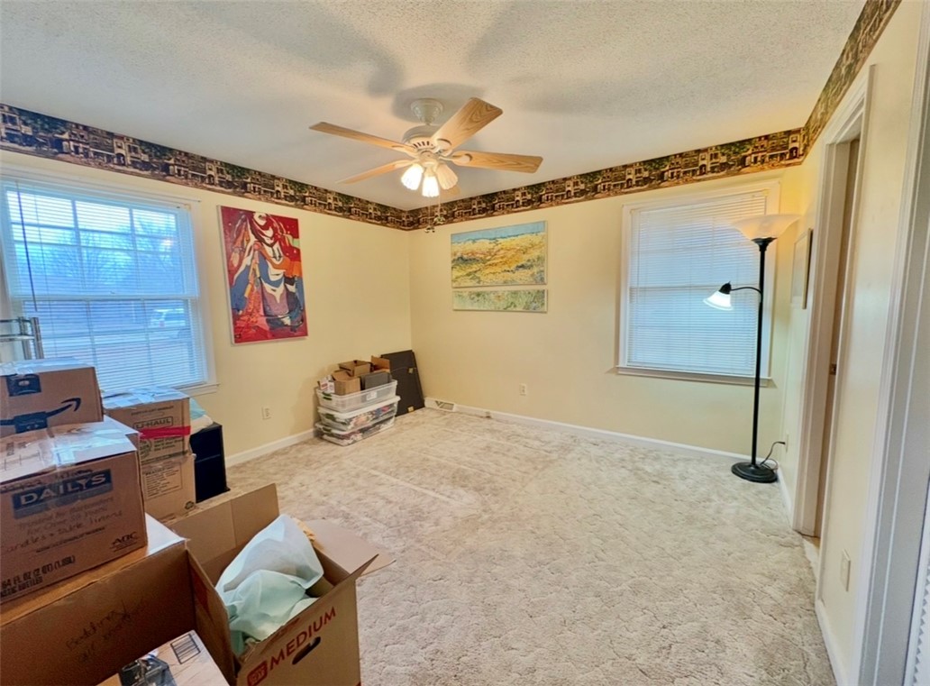 402 Loblolly Drive Anderson, SC 29625 - Photo 23 of 43 This versatile room features warm walls, carpet, and a ceiling fan for comfort.