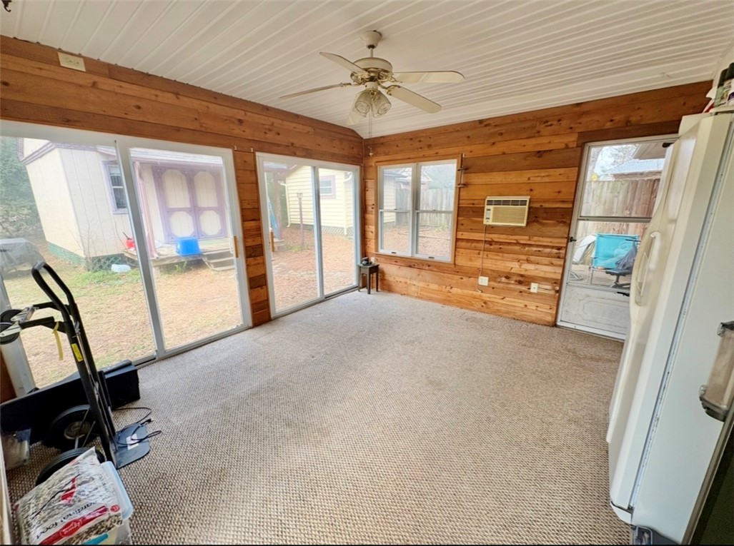 402 Loblolly Drive Anderson, SC 29625 - Photo 31 of 43 This bright sunroom with wood paneling and large windows offers a serene indoor-outdoor connection.
