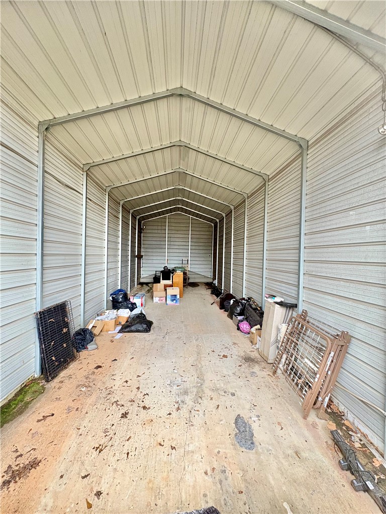 402 Loblolly Drive Anderson, SC 29625 - Photo 38 of 43 This metal structure offers versatile storage or shelter, ready for various uses.