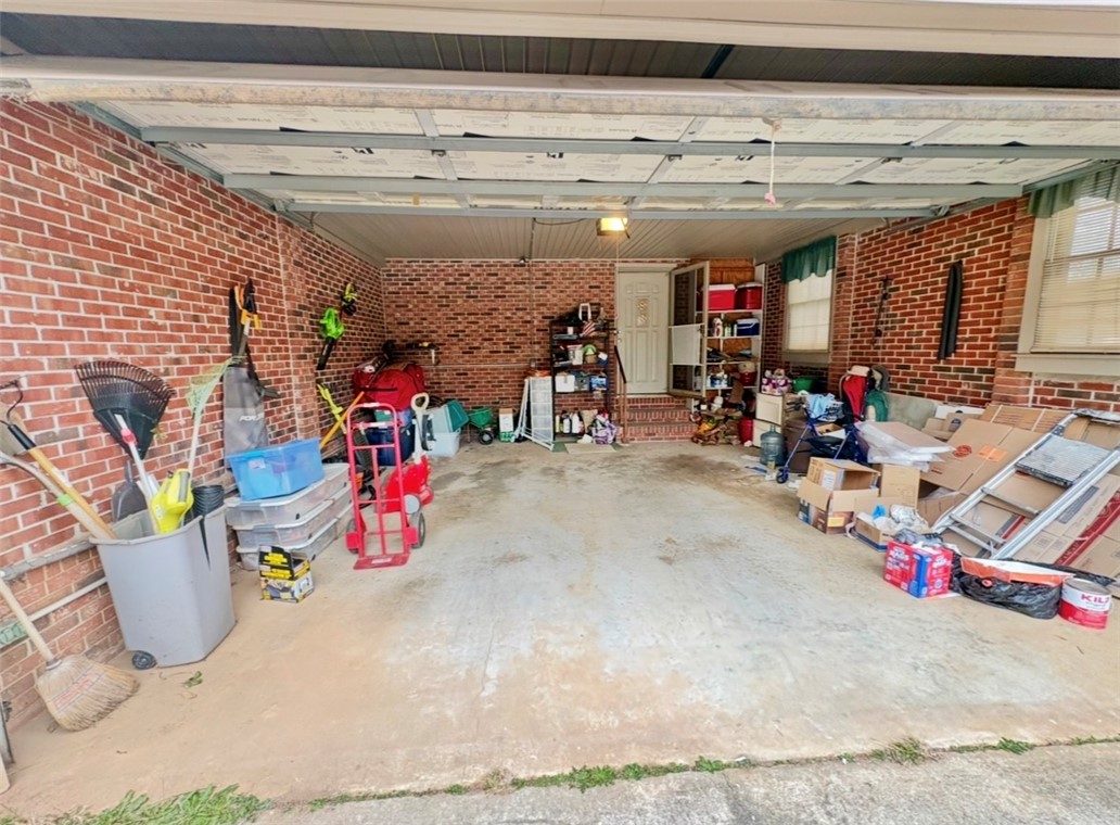 402 Loblolly Drive Anderson, SC 29625 - Photo 42 of 43 This spacious attached garage offers ample storage solutions and direct home access.